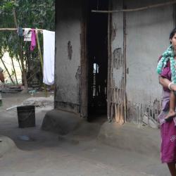 A Displaced Koch Rajbanshi woman with her children