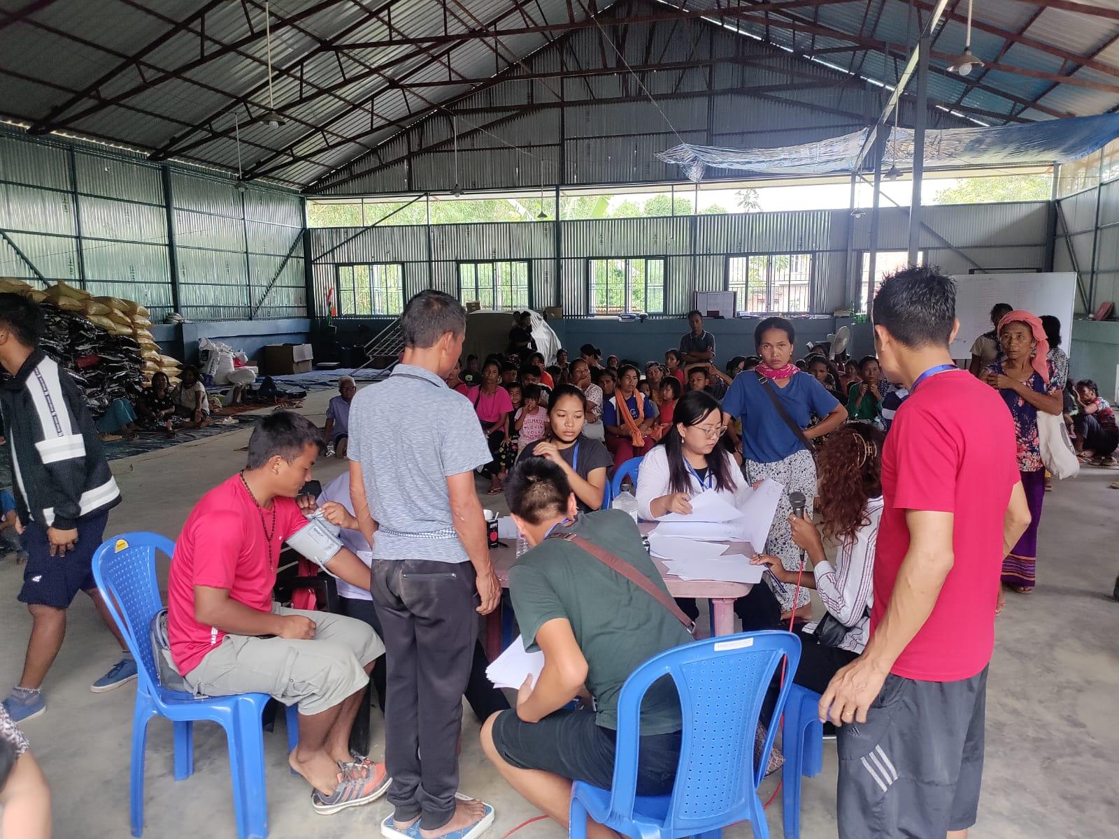 Free health camp organised by Rural Women Upliftment Society at Churachandpur for the displaced people staying in camps