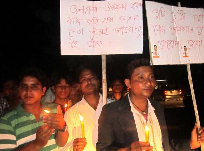 Candle light prayer at Narayanpur for quick recovery of Mani Kumar Subba
