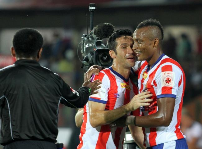 Fikru Tefera Lemessa of Atletico de Kolkata celebrates his goal with Luis Javier Garcia Sanz of Atletico de Kolkata during match 5 of the Hero Indian Super League between NorthEast United FC and Atletico de Kolkata held at the Indira Gandhi Stadium, Guwahati, India on the 16th October 2014.  Photo by: Deepak Malik/ ISL/ SPORTZPICS