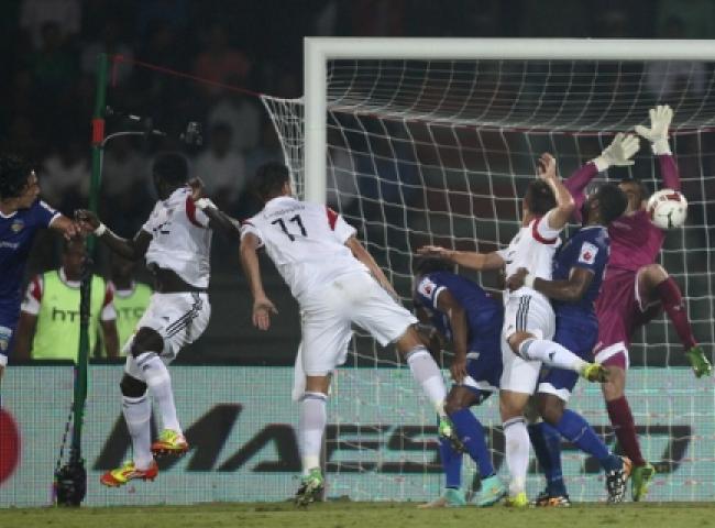 Chennaiyin FC goalkeeper Gennaro Bracigliano fails to make the save as Massamba Lo Sambou of NorthEast (far Left) United FC scores the second goal during match 42 of the Hero Indian Super League between NorthEast United FC and Chennaiyin FC held at the Indira Gandhi Stadium, Guwahati, India on the 27th November 2014. Photo by: Shaun Roy/ ISL/ SPORTZPICS