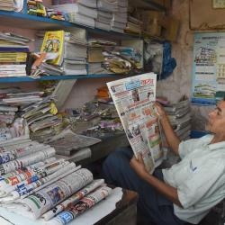 A newspaper salesman reads a local newspaper during Janata Curfew at Tezpur on 22-03-2020. Pix by UB Photos