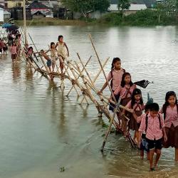 School children are facing hardship in communication to their school in Karimganj district because of flood