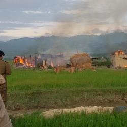 The burnung hemlet: thatched houses set on fire by miscreants in Uriam Ghat area. Photo: Bibeka Dutta