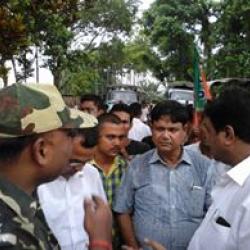 BJP MLAs Ranjit Kr Das and Jadob Deka talking stock of situation at Chetiagaon in Uriamghat on Thursday