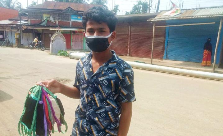 A boy selling masks in Hailakandi town, Assam 23-04-2020 during lockdown. Photo by UB Photos.