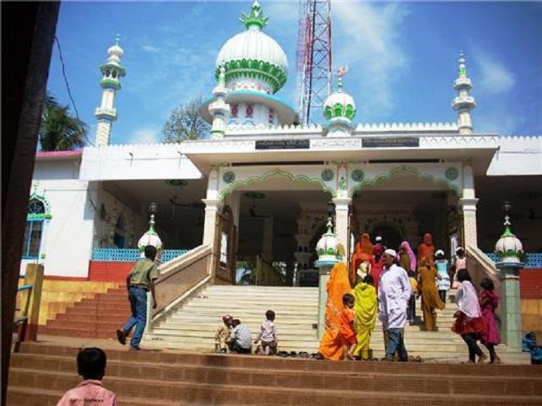 Pao Mecca Mosque at Hajo, Kamrup Dist, Assam  , where a  group of both men and women devotees are entering the mosque.
