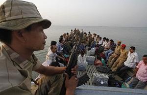 Election officials and security personnel along with EVM