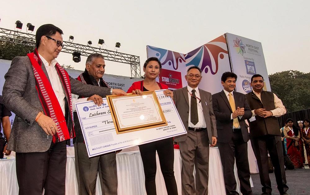 L Sarita Devi is being felicitated 