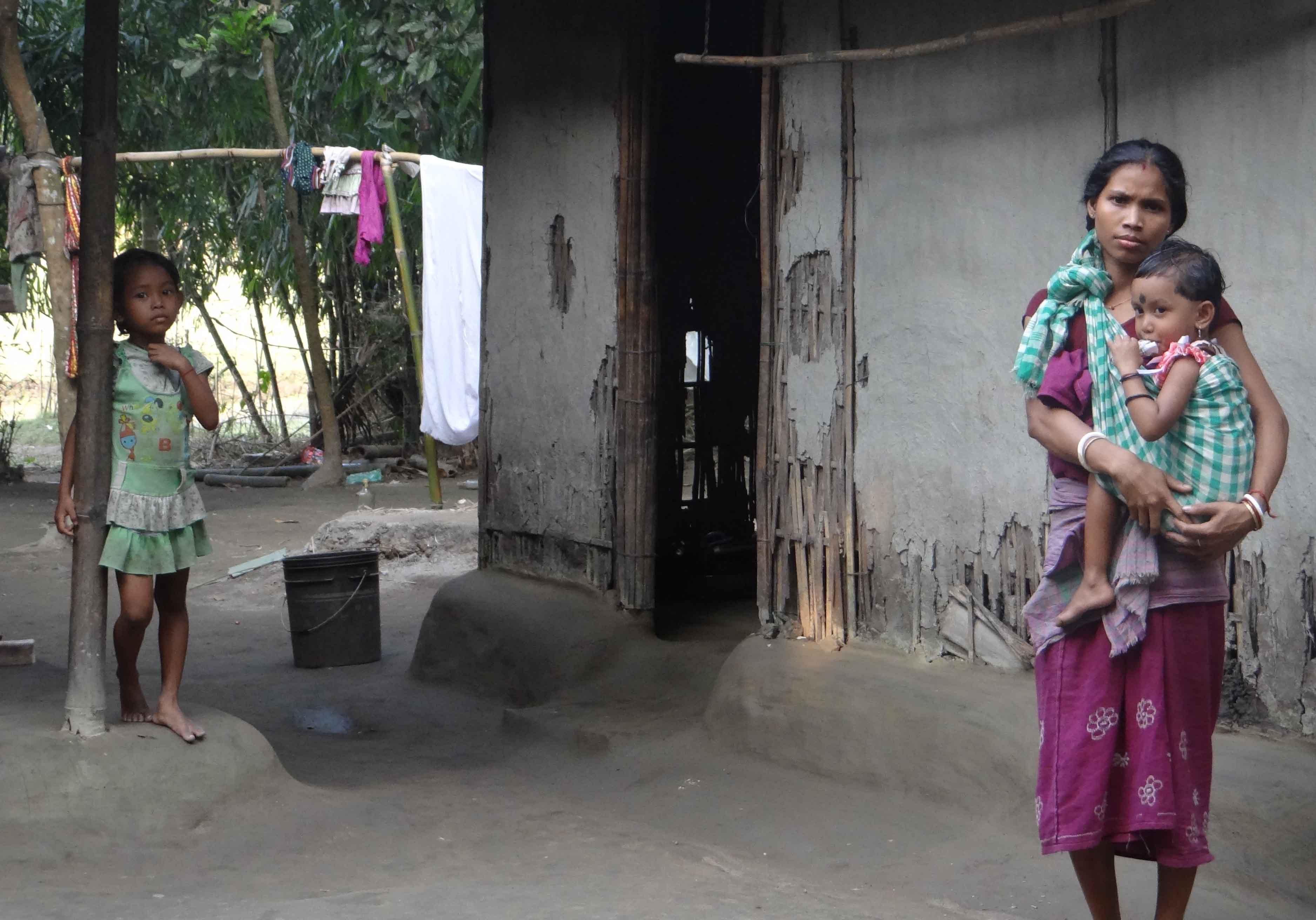 A Displaced Koch Rajbanshi woman with her children