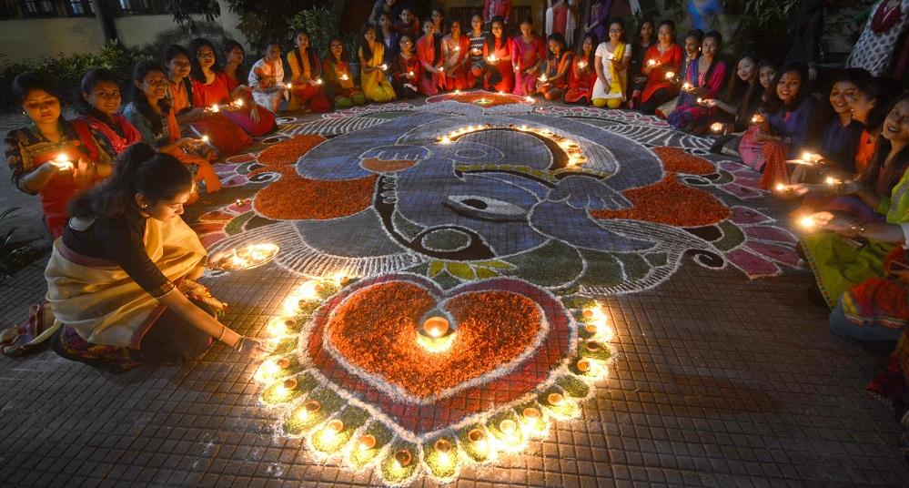Students of Nalini Bala Devi Girls' Hostel, Cotton University lightning lamps on Thursday. Pix by UB Photos.