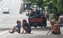 Beggars in the empty GS Road, near Bhangarh during Lockdown in the city on Sunday.  Photo by UB photos