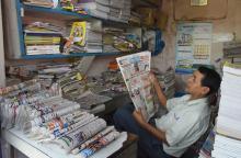 A newspaper salesman reads a local newspaper during Janata Curfew at Tezpur on 22-03-2020. Pix by UB Photos