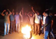 Activists of Krishak Mukti Sangram Samiti (KMSS) protest by burning tyres in front of DC Office against arresting the KMSS leader Akhil Gogoi in Golaghat on Tuesday. Photo by UB Photos.