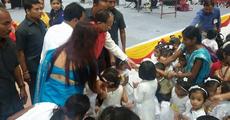 Smiling Gogoi talks to children 